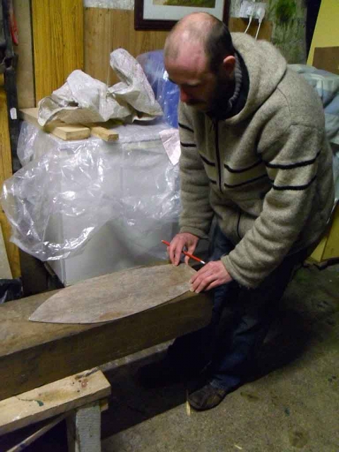 Brian marks out the block with the hull template.